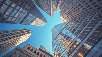 View of skyscrapers, looking up from the street.