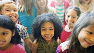 Group of children smiling at camera.